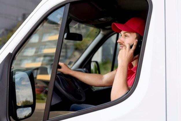Delivery man talking over phone