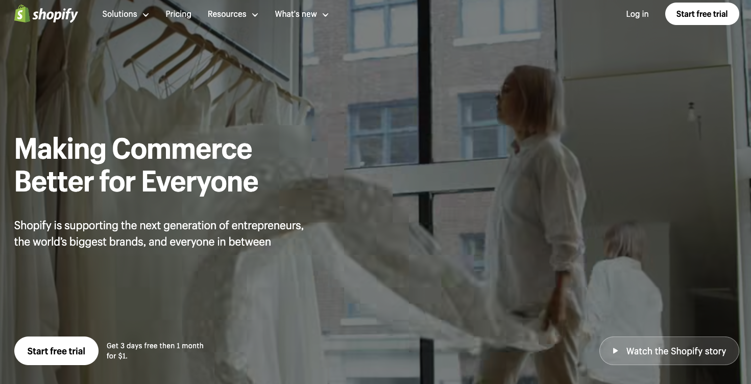 Shopify uses white text against a dark background overlay to bring users’ eyes to its marketing message. 
