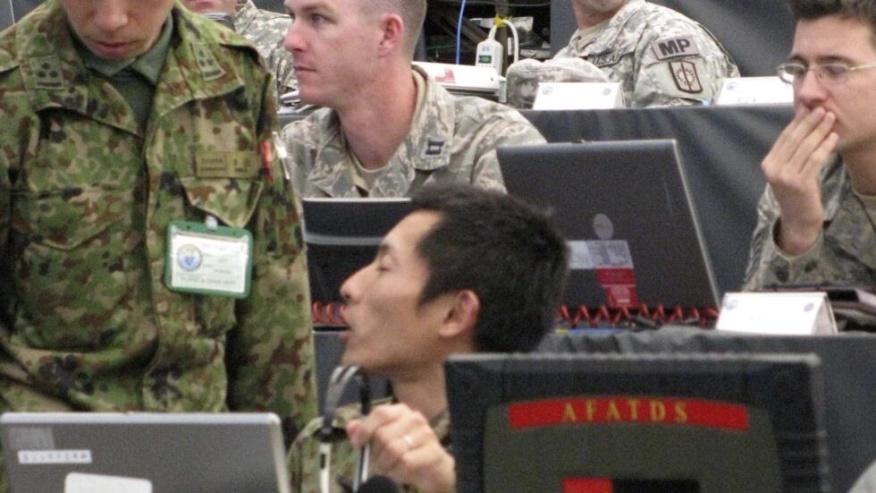 U.S. and Japanese soldiers follow computer simulations of an attack during exercises, called "Yama Sakura," at Camp Kengun, Kumamoto prefecture (state) on Japan's southernmost main island of Kyushu Th