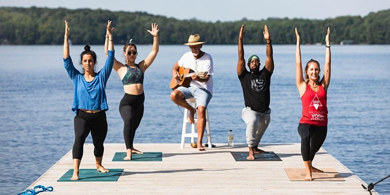 Muskoka Chautauqua - yoga being performed on a dock