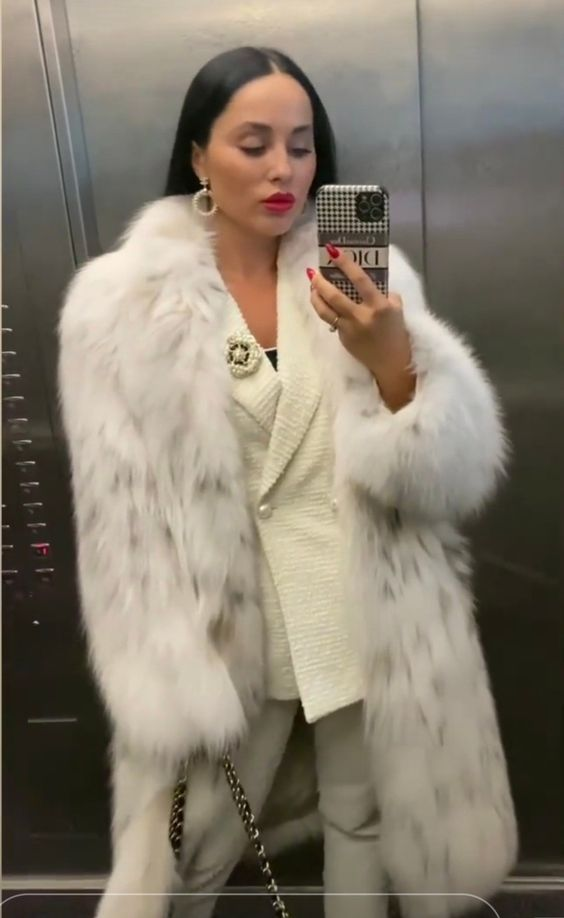 Fabrics to Match with Faux Fur: Picture of a lady pairing her faux fur with white suit