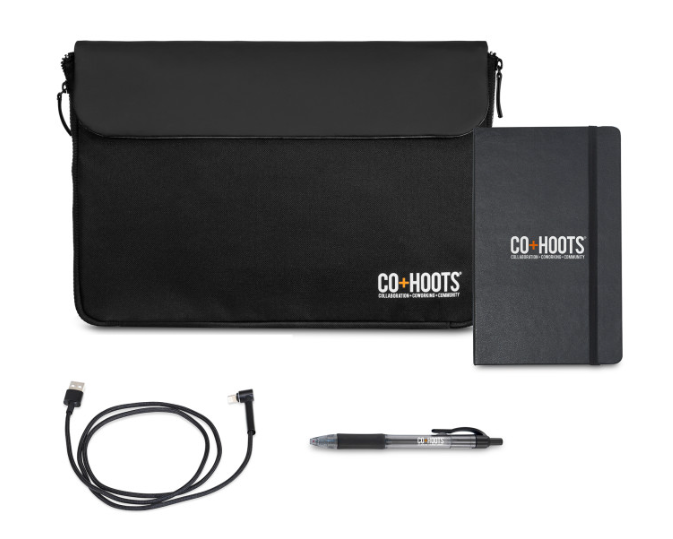 Screenshot of notebook, pen, charging cable, and office sleeve. 