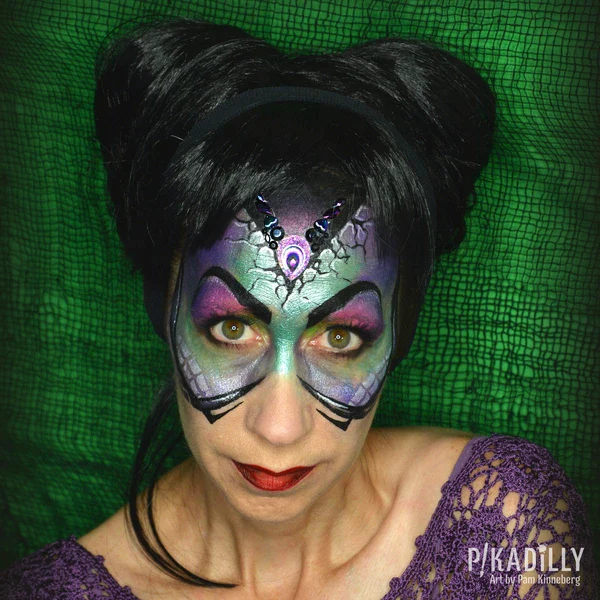 Picture of a lady rocking the maleficient face paint idea