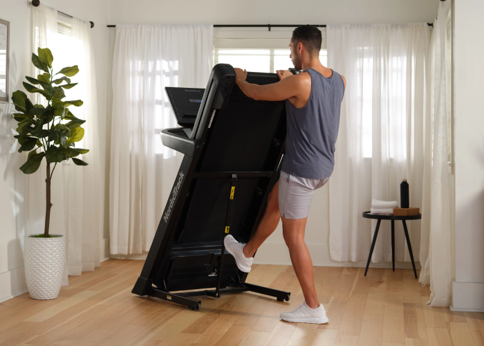 Man Demonstrates How Some NordicTrack Treadmill Models Fold Up With the SpaceSaver Design and Easy Lift Assist