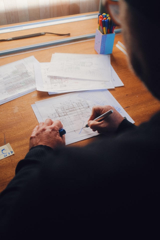 An architect working on a sketch of a building using parametric design principles