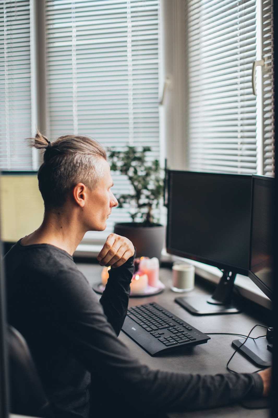 Man Working with Multiple Computer Screens