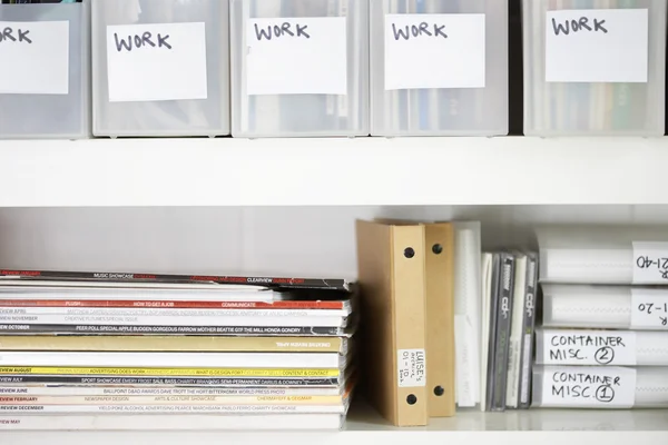 Magazines and folders organized in filing cabinet