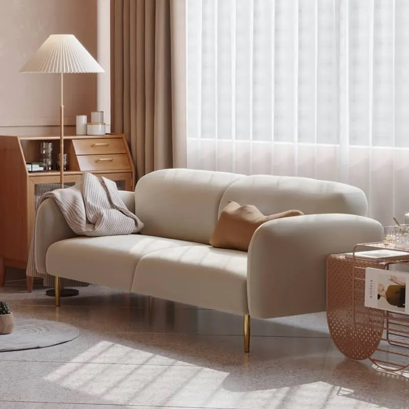 White fabric 3-seater sofa with gold steel legs, showcasing a firm-looking design.