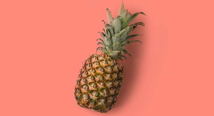 a pineapple on flat surface