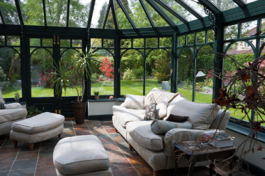 top interior design strategies for your sunroom addition sofa and plants near backyard custom built michigan