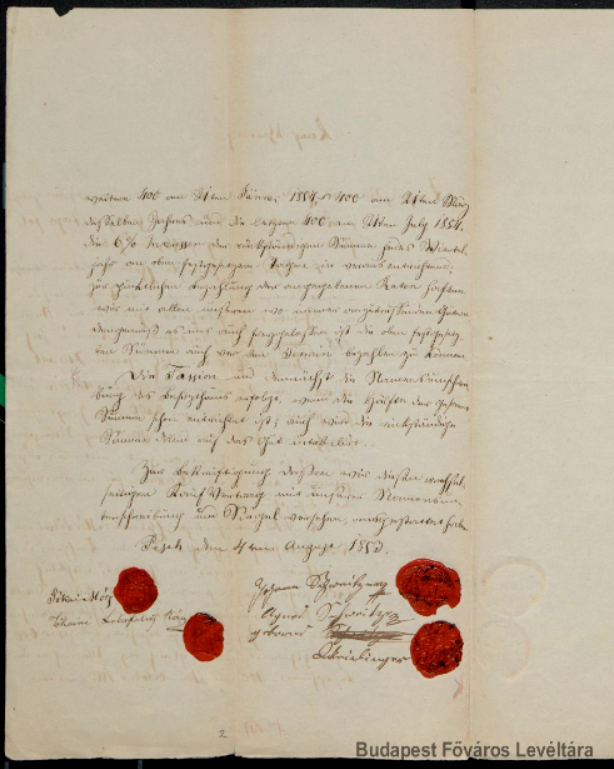 A handwritten document with red wax seals Description automatically generated