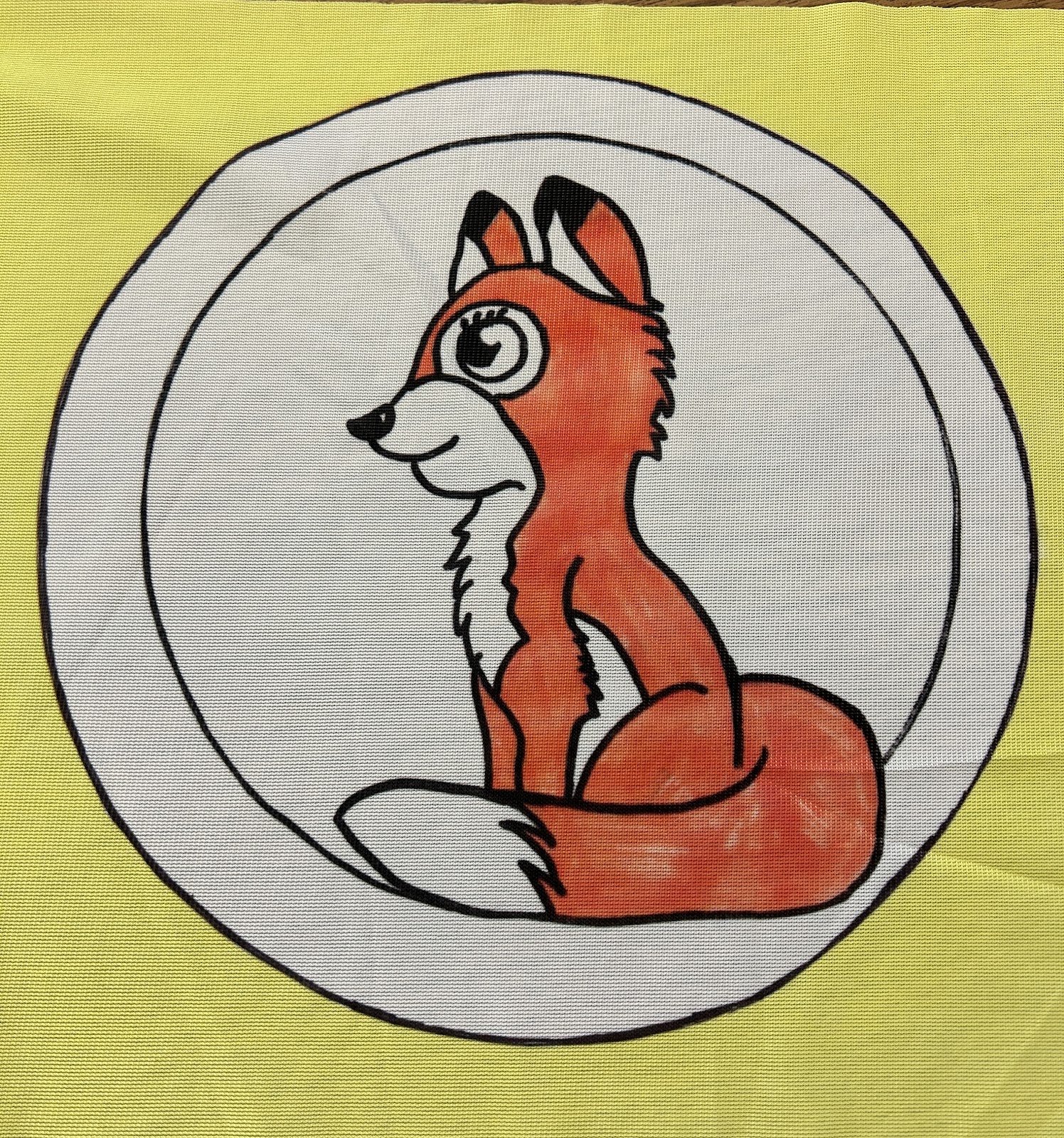 image of new flag with a fox in a circle and yellow background