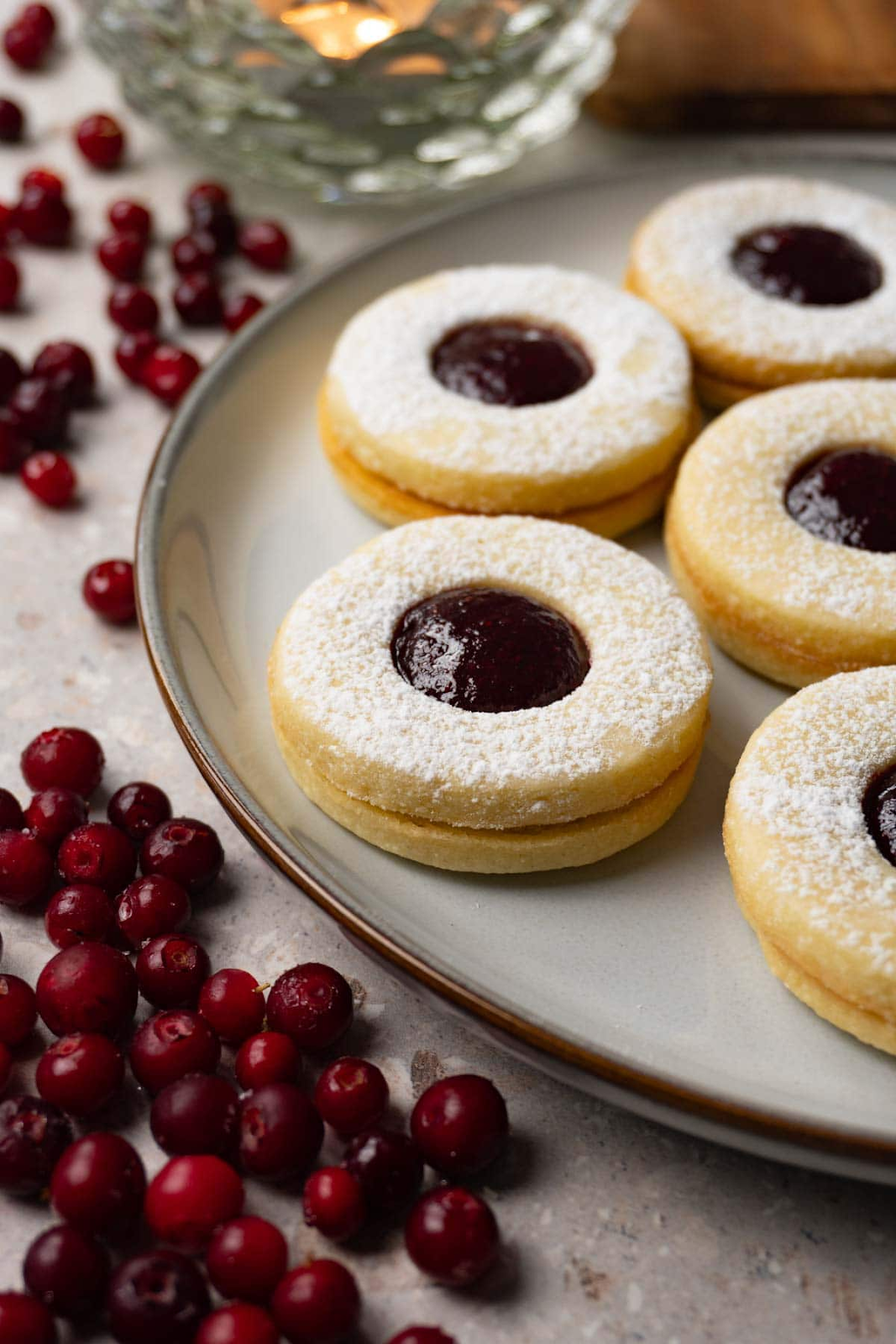 linzer cookies, sprinkled with powdered sugar and jam centers
