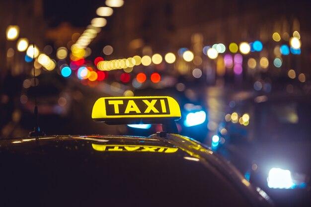 taxi car over bokeh lights