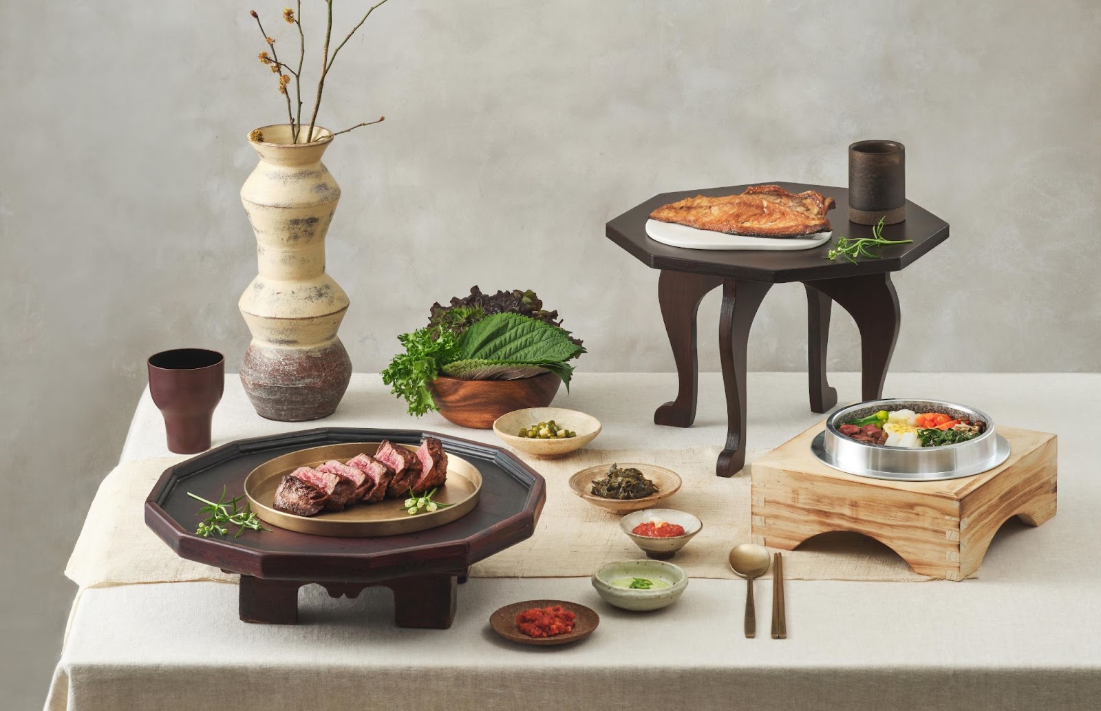 Artistic display of Jagalchi dishes on different types of plates and plate stands