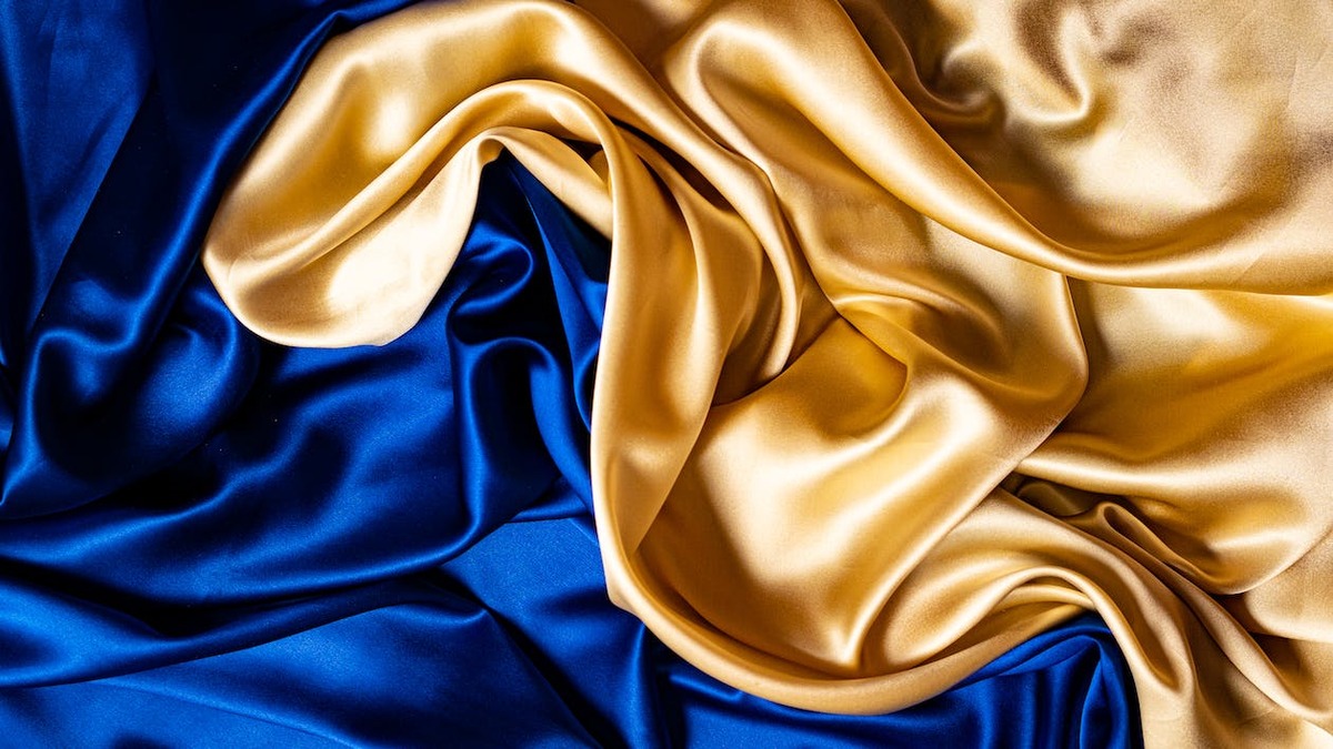 Close-up image of blue and gold silk fabrics