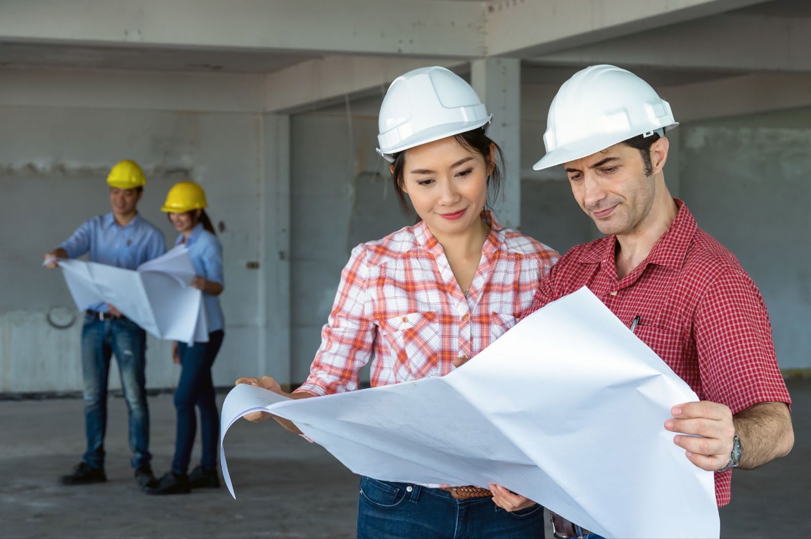 A team of construction builders assessing their plan. 