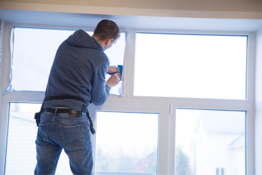 how to insulate your windows in cold weather contractor applying window film custom built michigan