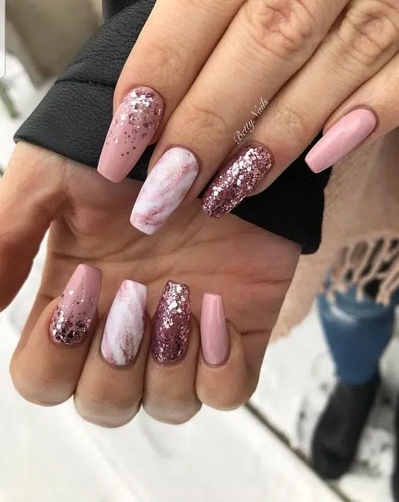 Picture  showing a pink marble nail with  with glitters