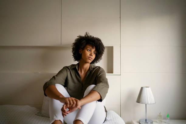 woman with depression at home - black woman stress stock pictures, royalty-free photos & images