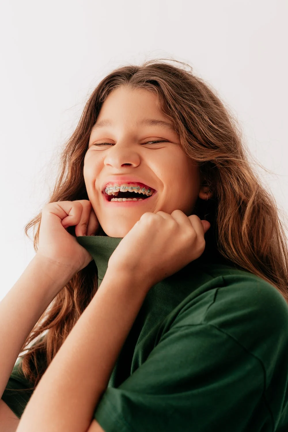 girl smiling showing off her braces