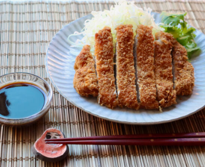 Tonkatsu: A comfort food favorite, Tonkatsu consists of a breaded, deep-fried pork cutlet that's both crunchy on the outside and tender on the inside. It's typically served with shredded cabbage and a tangy sauce.