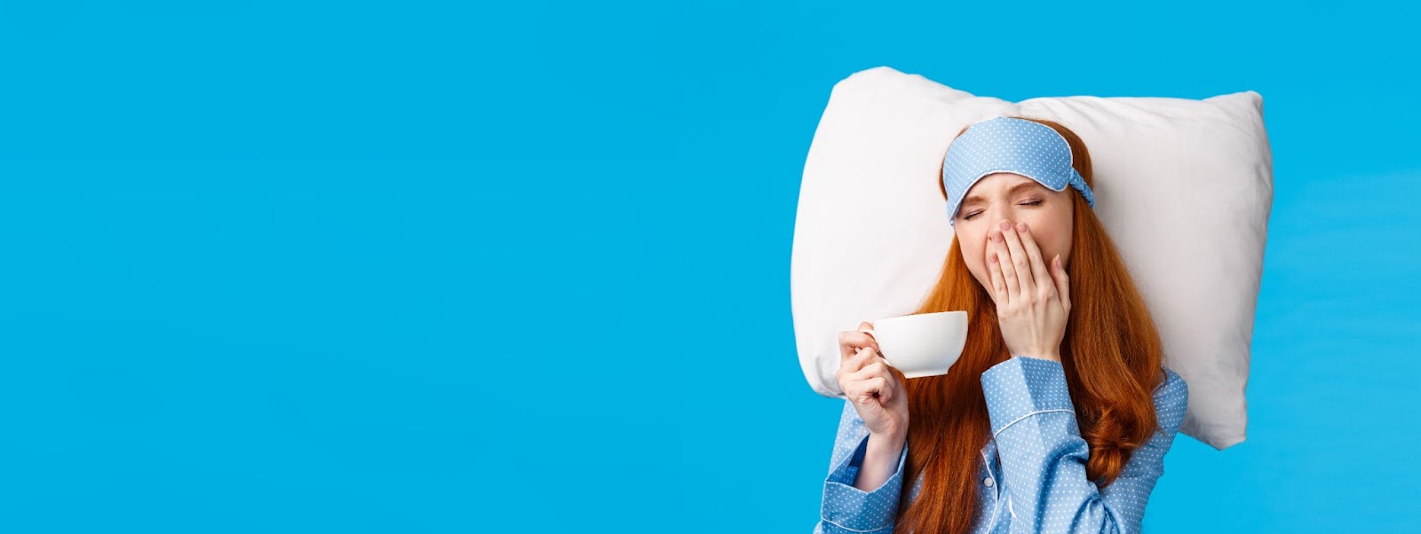 Woman tired with coffee cup in hand