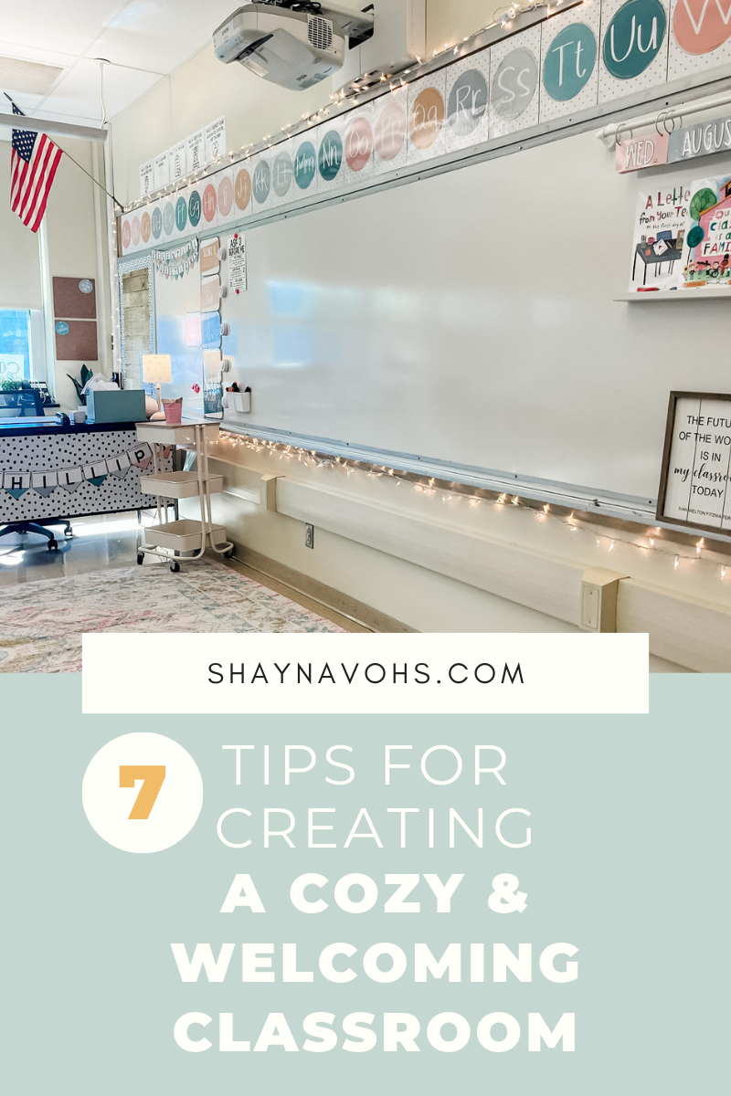 This image shows a cozy classroom with a rug, twinkle lights, and calm colored classroom decor. The text at the bottom of the image reads "7 tips for creating a cozy and welcoming classroom." 