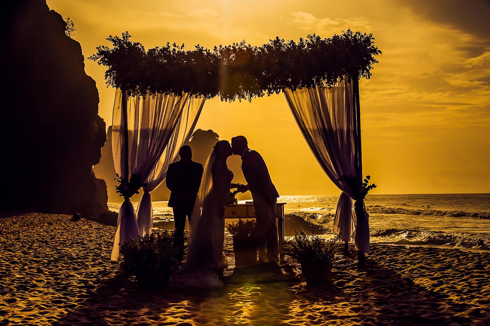 Sunset ceremony setup on the beach overlooking the ocean.