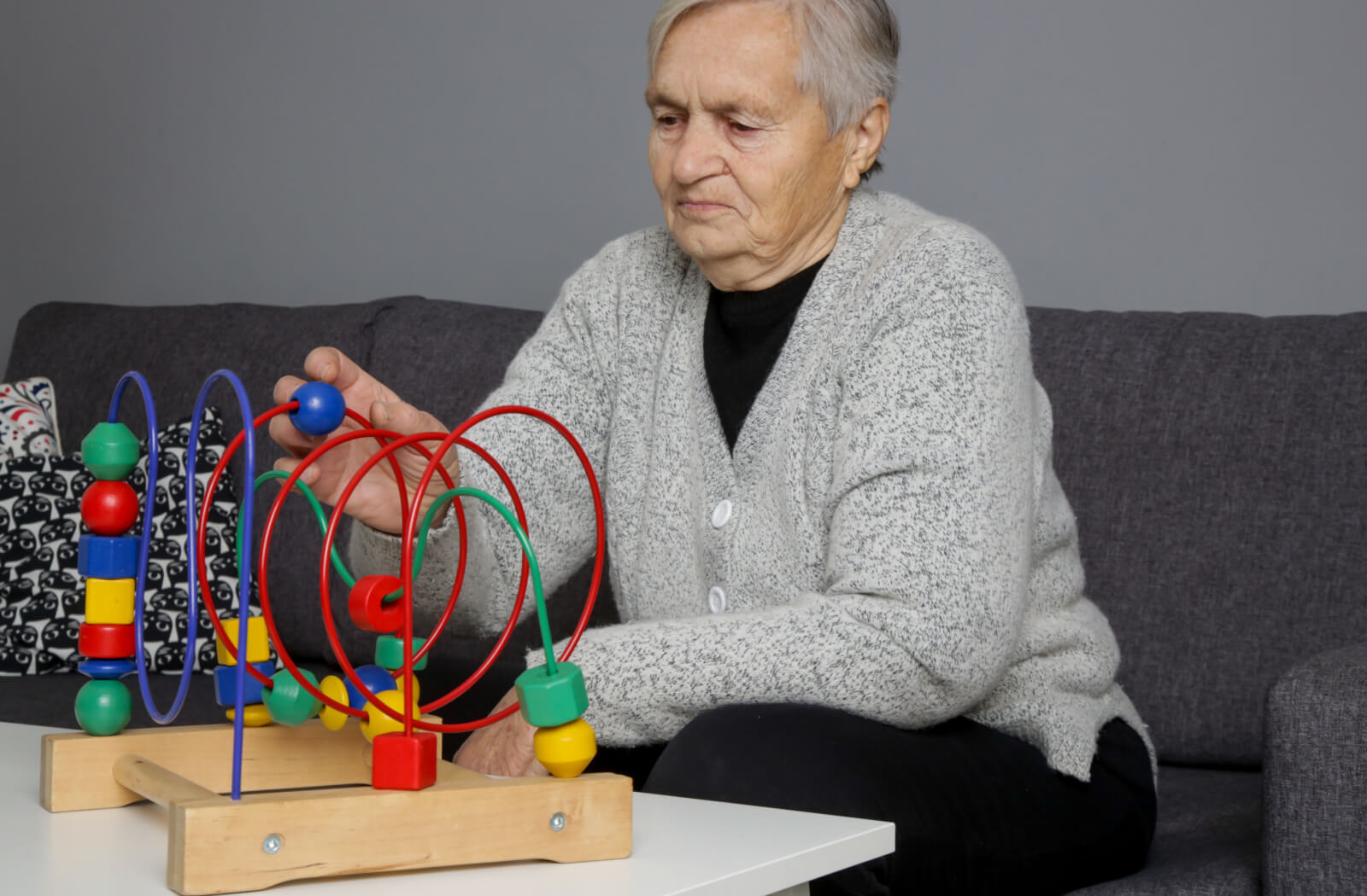 An older adult undergoing cognitive stimulation therapy.
