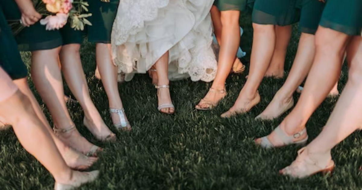 A group of people's legs in the grassDescription automatically generated