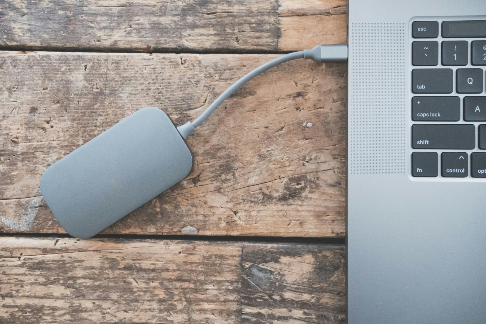 An external hard drive connected to a laptop.