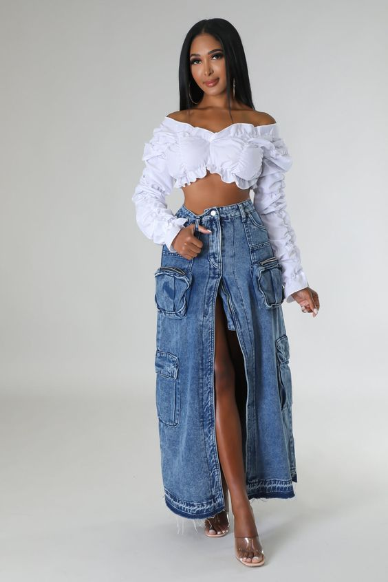 Full view of lady rocking the denim  maxi skirt with slit