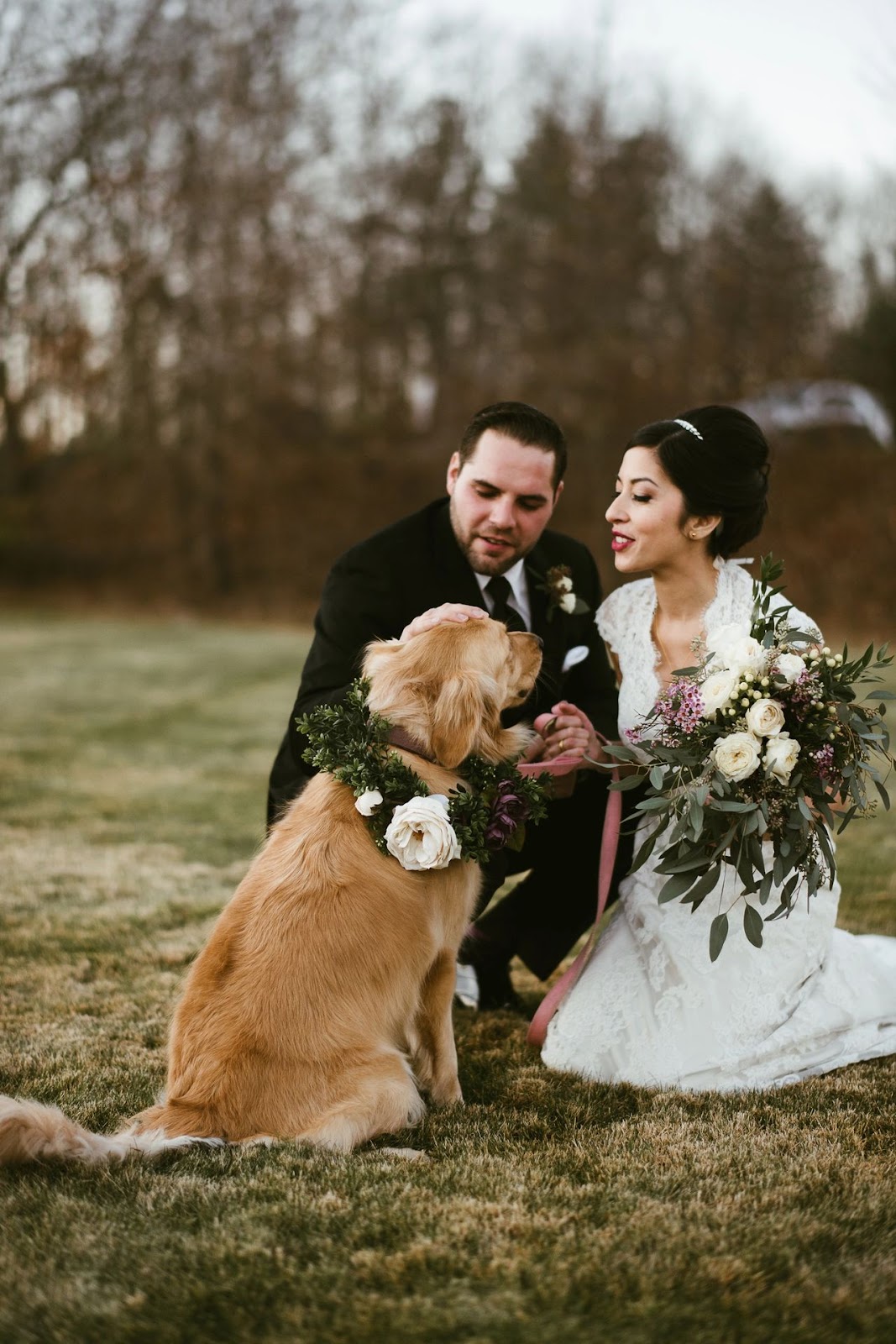 Couple with dog on wedding day.