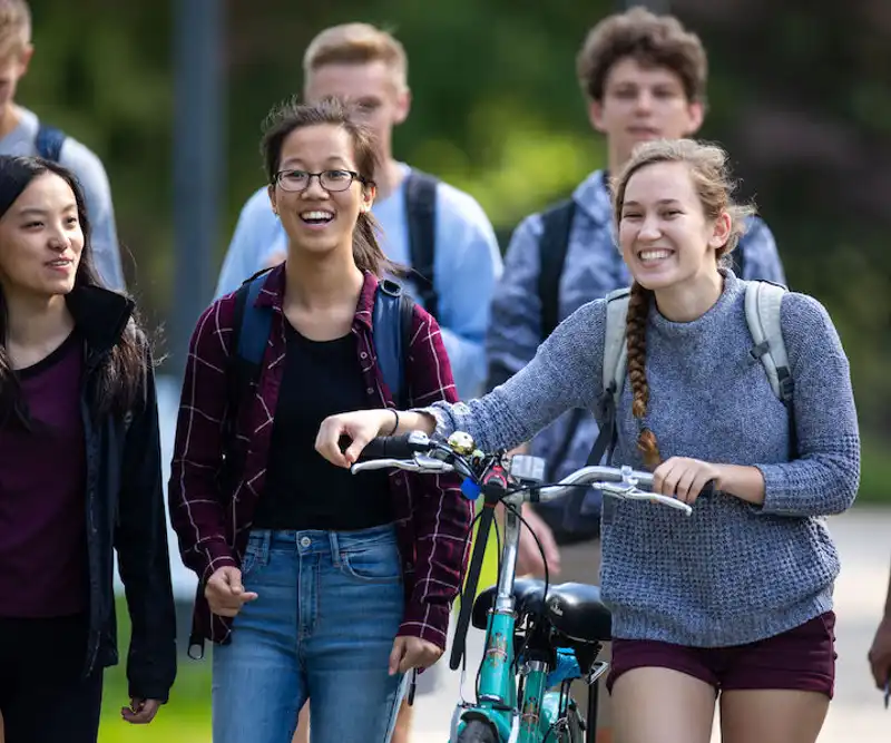 Different medical students walking heading to campus