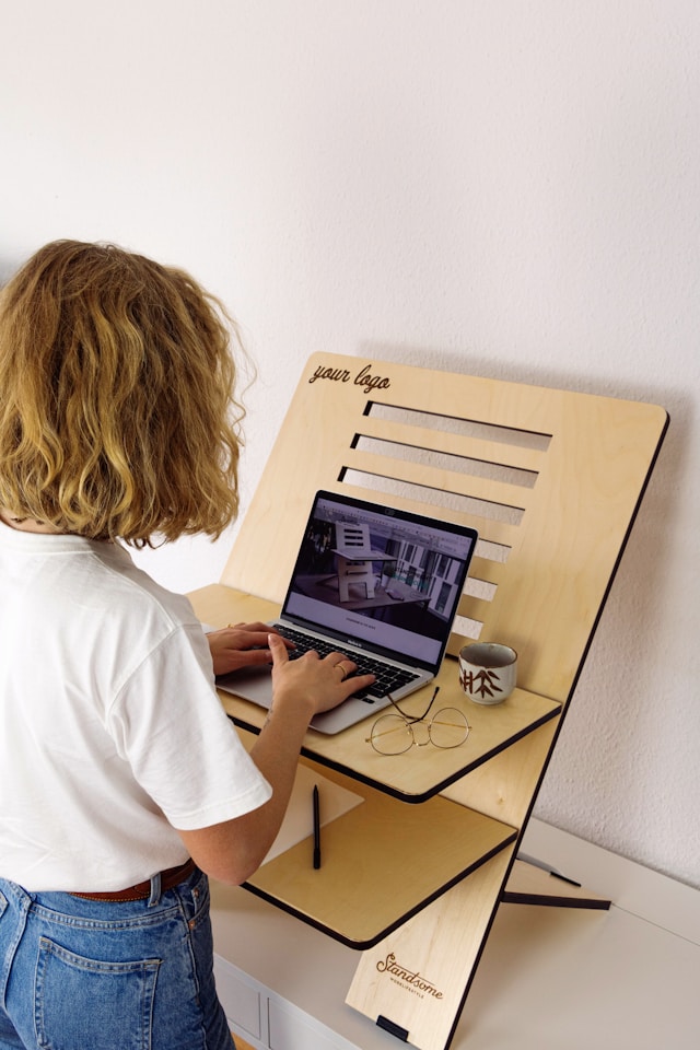 A person working on an adjustable ergonomic desk-The role of human anthropometry in architecture and interior design is very important.