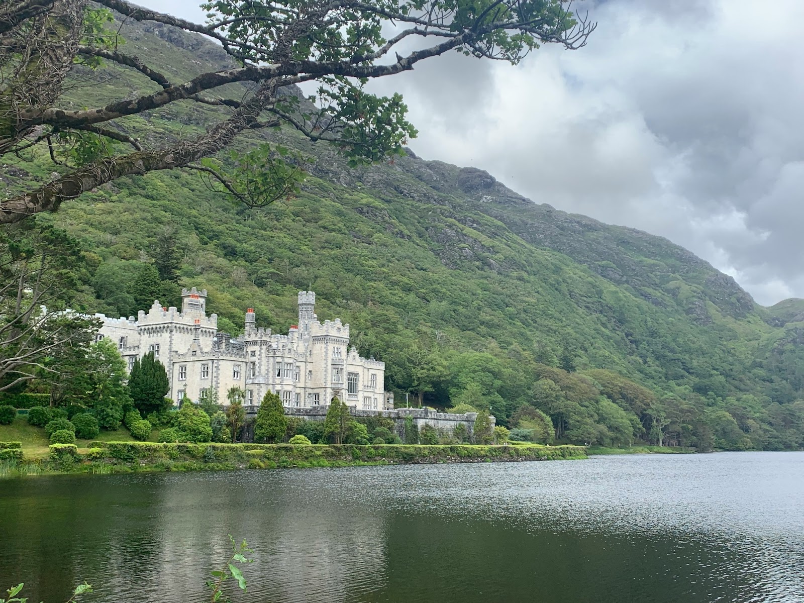 An elegant castle surrounded by lush greenery in Ireland.