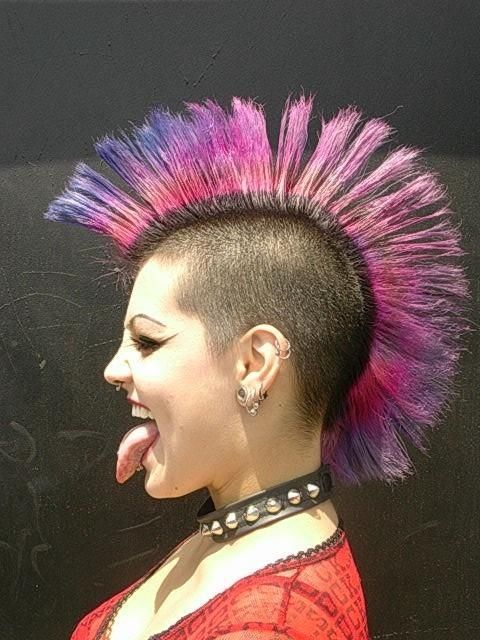 Side view of a lady  wearing the classic punk mohawk