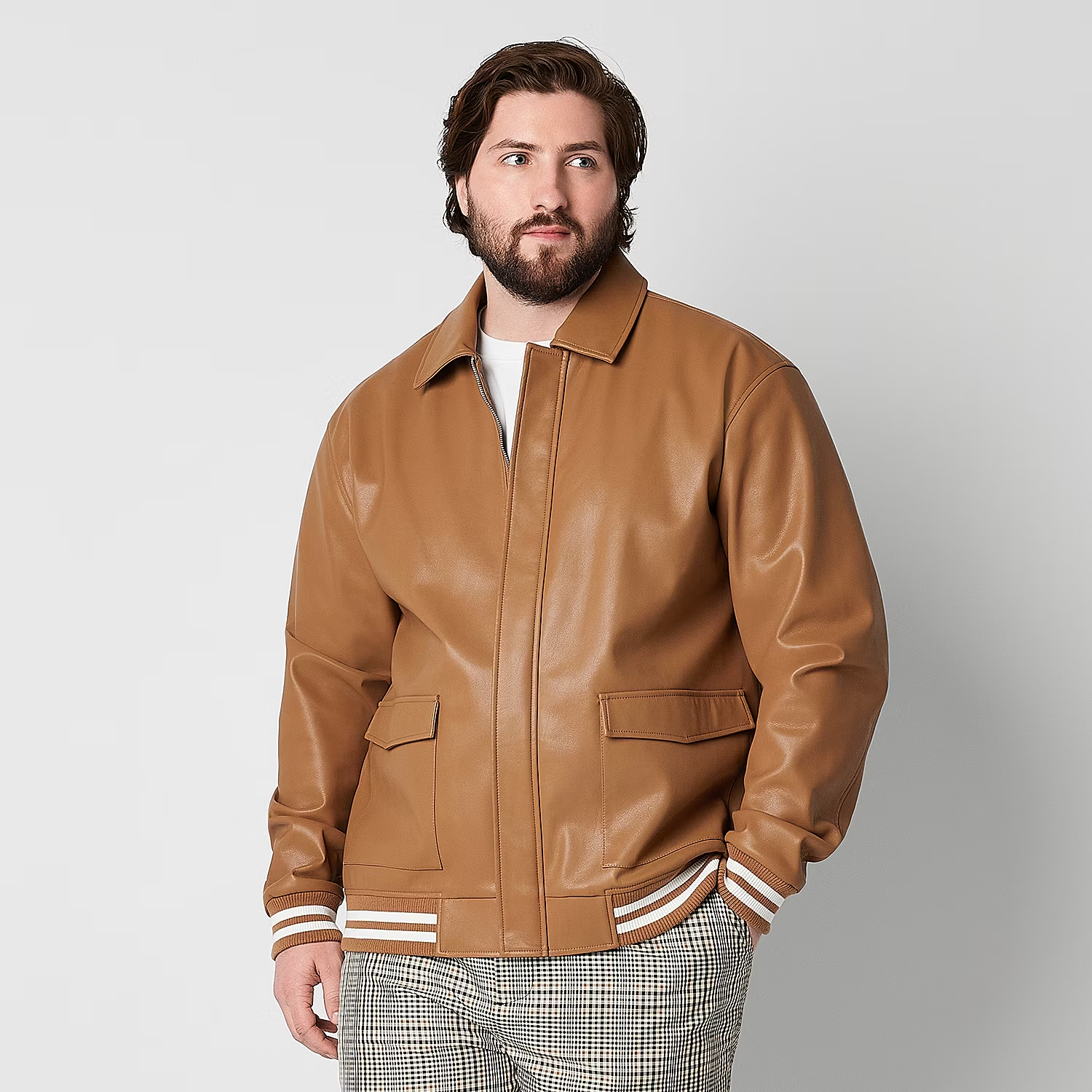 man wearing a brown bomber jacket