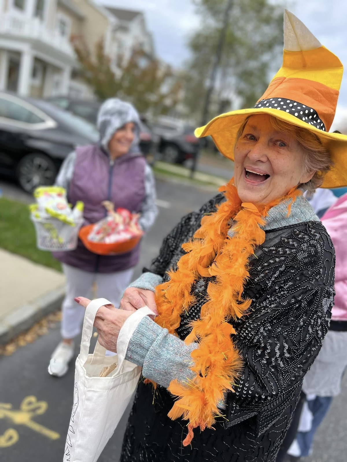 An elderly woman wearing a Halloween costume