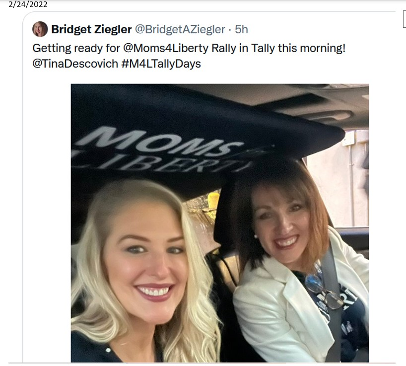 A couple of women in a car

Description automatically generated