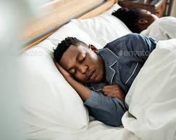 Image of person sleeping soundly in bed