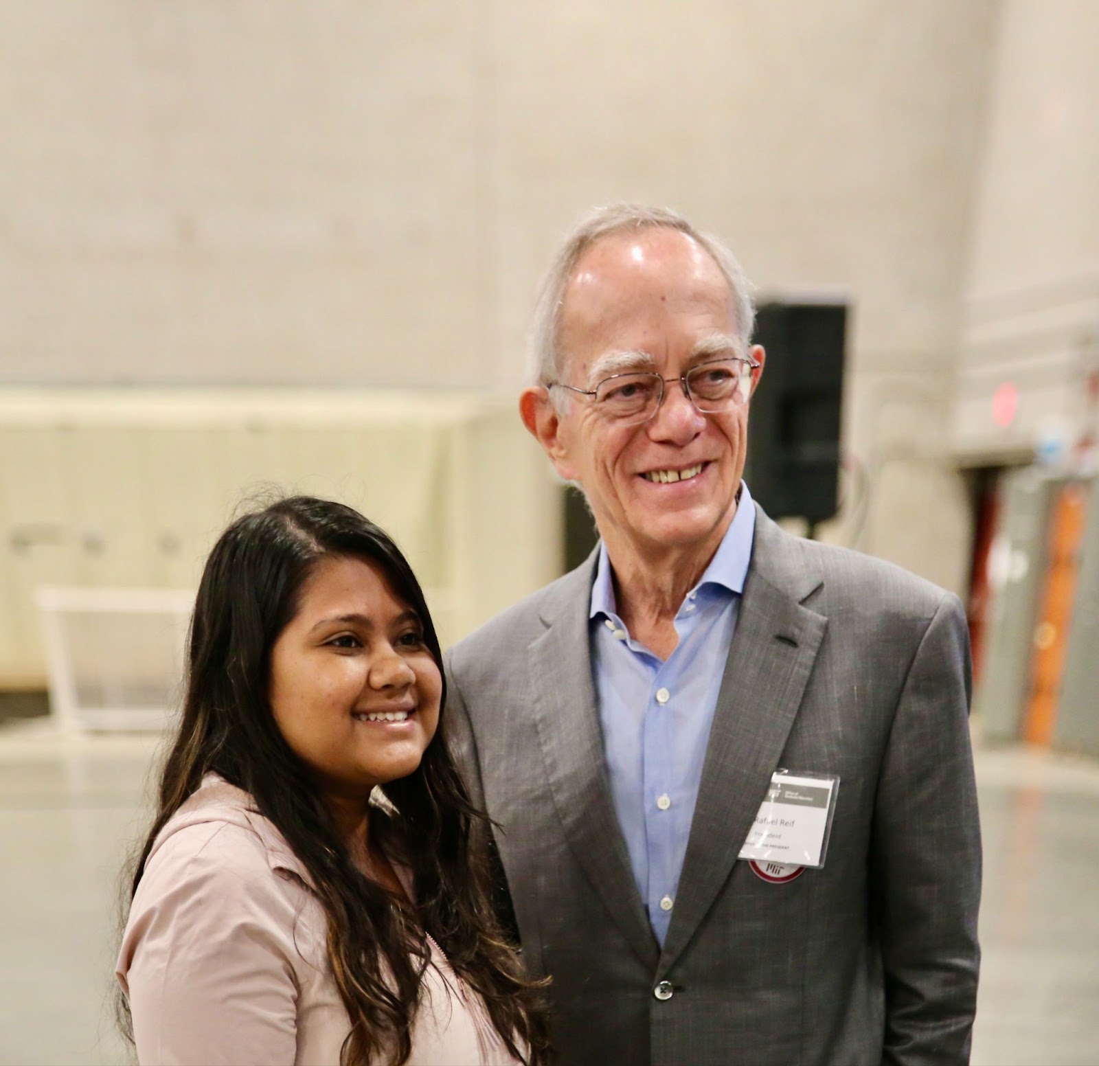Nayantara poses, smiling, with former M.I.T. President Reif.