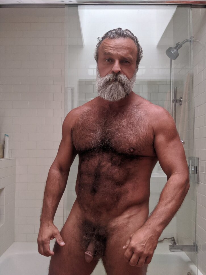 Daddy John naked in the bathroom showing off his flaccid cut penis