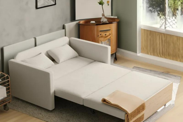 A medium-firm, white pull-out sofa bed with linen upholstery, featuring latex for bounce and a high-density sponge for structural support. 