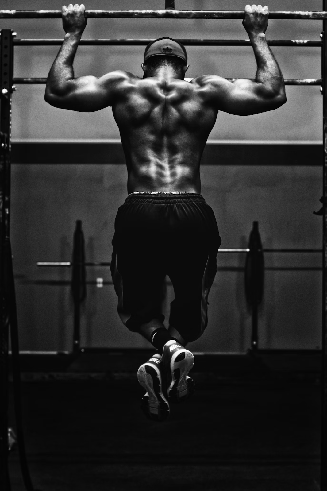 Bodybuilder's Grayscale Photo of Working Out