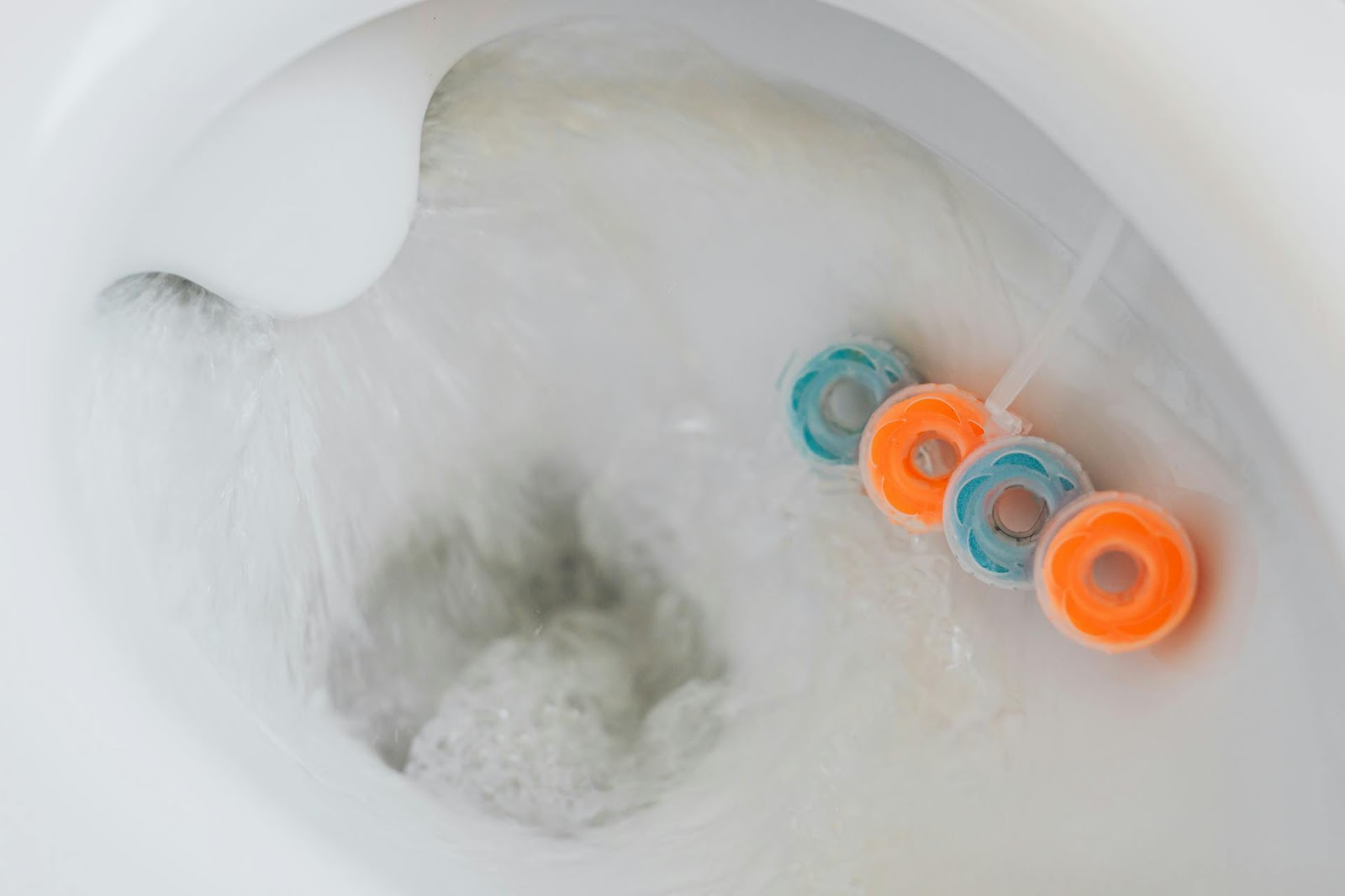 best toilet cleaners - a flushing bowl with automatic cleaners