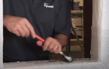 Roll a J roller over the flashing for full adhesion 