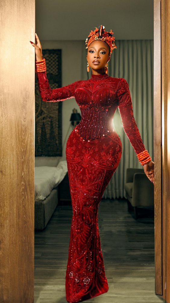 Picture of Ini dinma Okojie slaying the Aso ebi fashion in red 