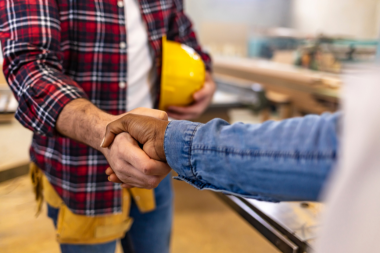 homeowner shaking hands with composite deck contractor custom built michigan